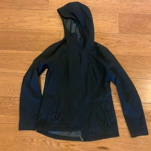 Black rain shell jacket, good for light rain/wind